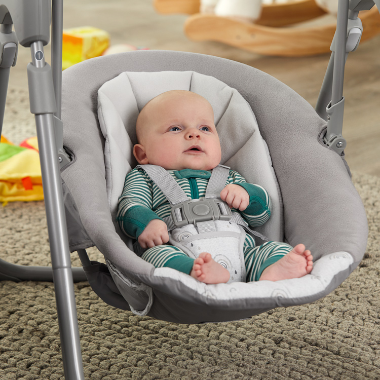 Baby resting in Graco Slim Spaces swing
