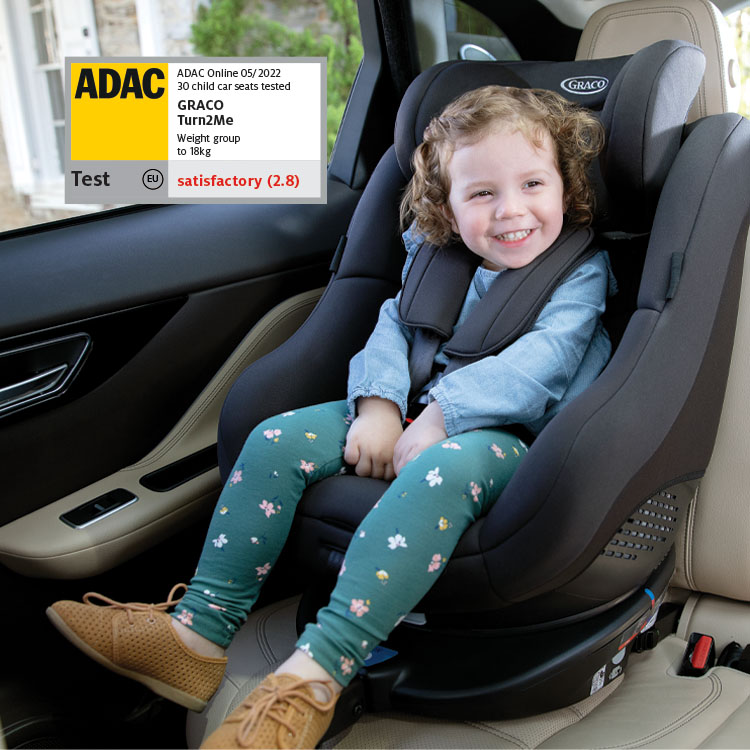 Girl buckled in Graco Turn2Me car seat with ADAC logo